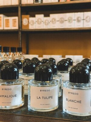 Elegant Byredo perfume bottles elegantly displayed in a Parisian store.